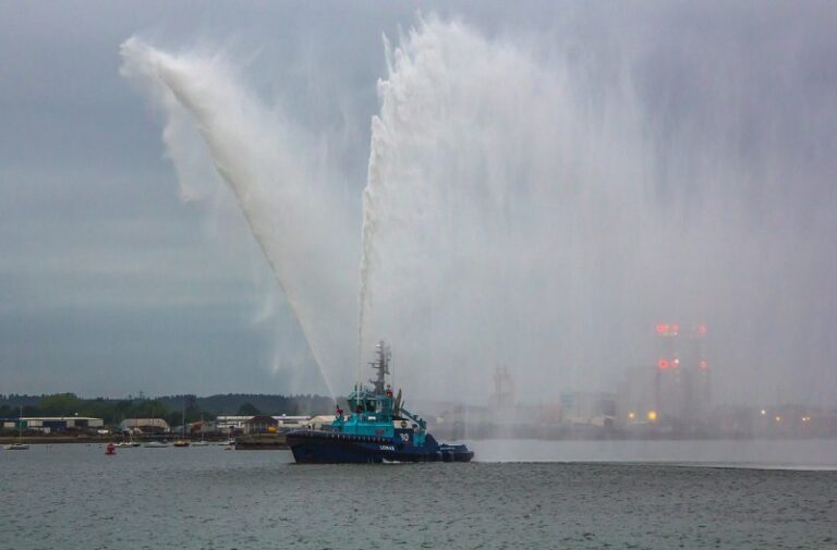 Tugboat spraying water