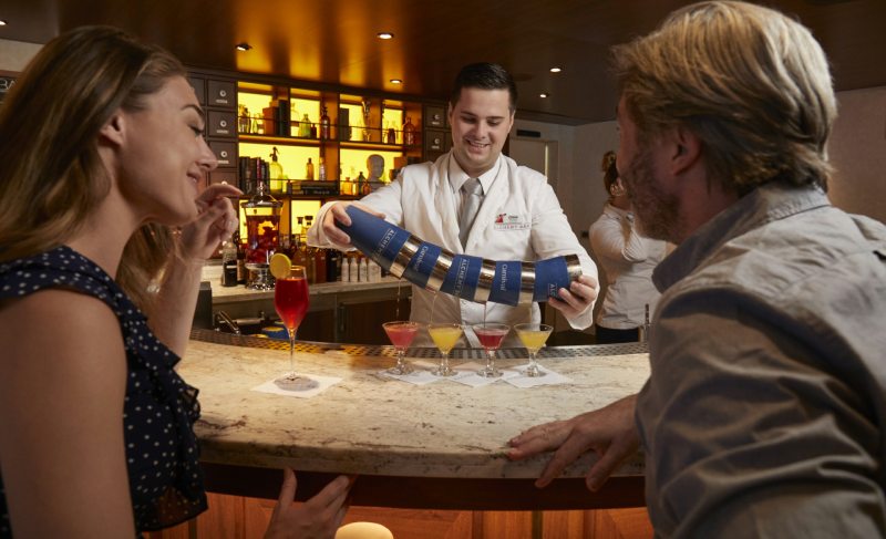 Guests enjoying drink at Alchemy bar on Carnival